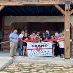 The ribbon-cutting ceremony with Mayor Ciri Villarreal, brewery founders, and Mathis EDC members.